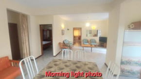 Spacious Groundfloor apartment 150m- public beach- AC both rooms